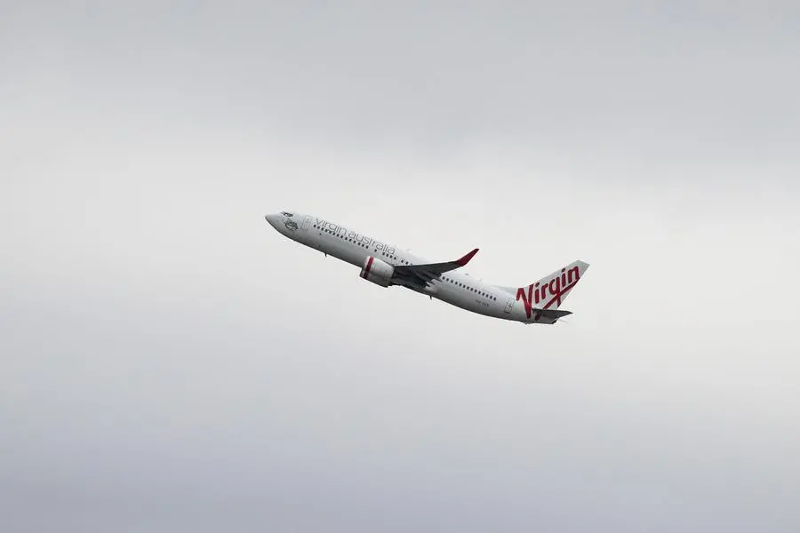 FILE PHOTO: A Virgin Australia Airlines Boeing 737-800 plane takes off from Sydney Airport in Sydney, Australia, October 28, 2020. REUTERS/Loren Elliott. , Reuters