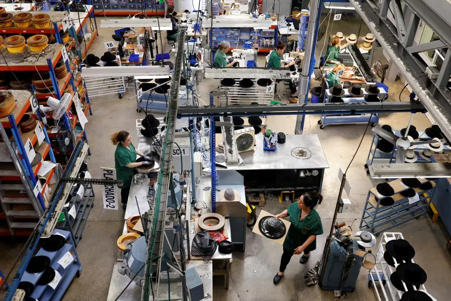 People work at 140-year-old Fernandez y Roche Industrias Sombrereras Espanolas factory, which produces Orthodox Jewish hats, in Salteras, near Seville, southern Spain, May 23, 2025. REUTERS/Marcelo del Pozo. , Reuters