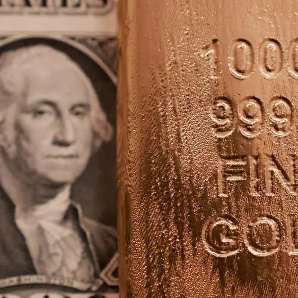 Gold jumps on weaker dollar, Middle East peace hopes