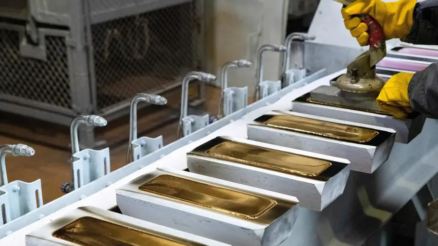 PRECIOUS-Gold extends fall to two-week low on firm dollar, Fed rate hike bets
