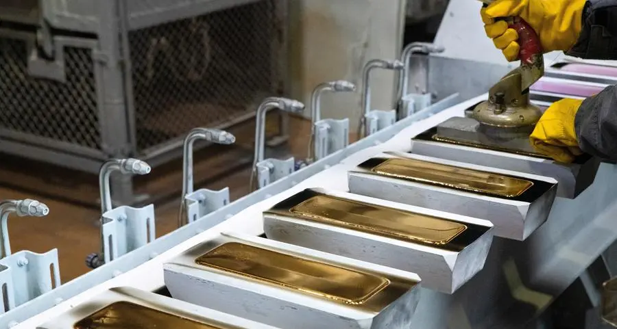PRECIOUS-Gold extends fall to two-week low on firm dollar, Fed rate hike bets