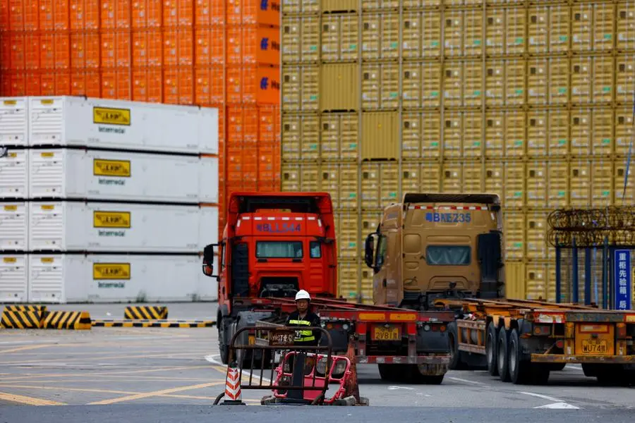 A security personnel stands guard at an entrance to a container logistics centre at the Yantian port in Shenzhen, Guangdong province, China May 9, 2025. REUTERS/Tingshu Wang. , Reuters