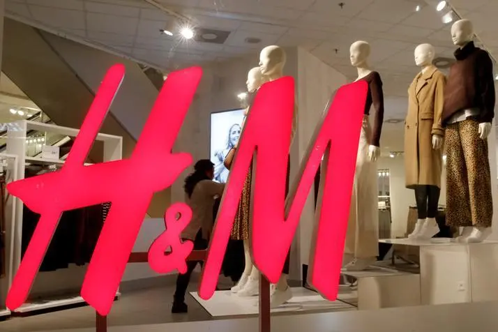 FILE PHOTO: The logo of H&M is seen in a display window of a store in Zurich, Switzerland January 7, 2019. Picture taken January 7, 2019. REUTERS/Arnd Wiegmann. , Reuters Images