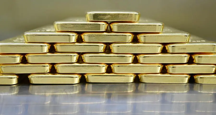 Gold inches lower from 3-week high as dollar ticks up, US reopening in focus