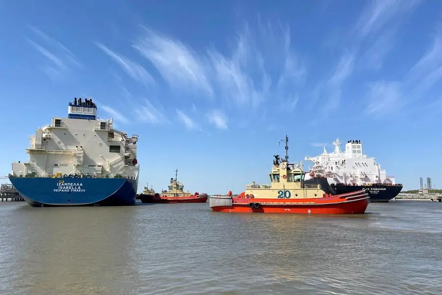 FILE PHOTO: An LNG tanker is guided by tug boats at the Cheniere Sabine Pass LNG export unit in Cameron Parish, Louisiana, U.S., April 14, 2022. REUTERS/Marcy de Luna. , Reuters
