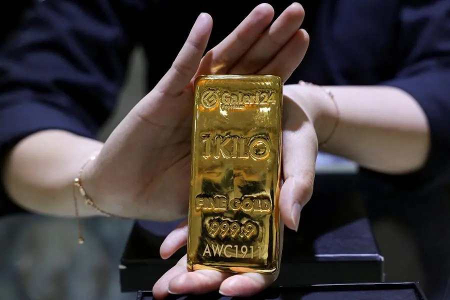 Gold steady as markets focus on US data; silver eases from record high