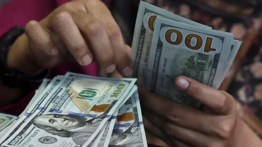 Dollar holds steady as mixed data sets up Friday's jobs report