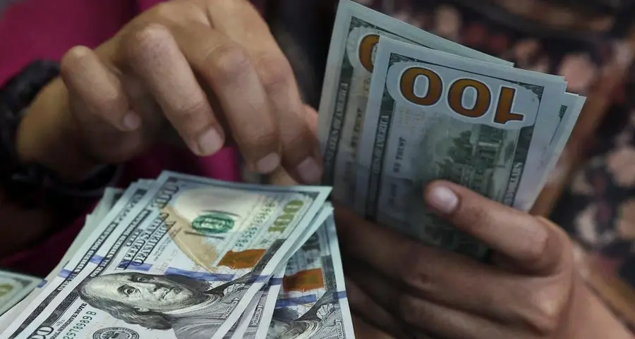 Dollar holds steady as mixed data sets up Friday's jobs report