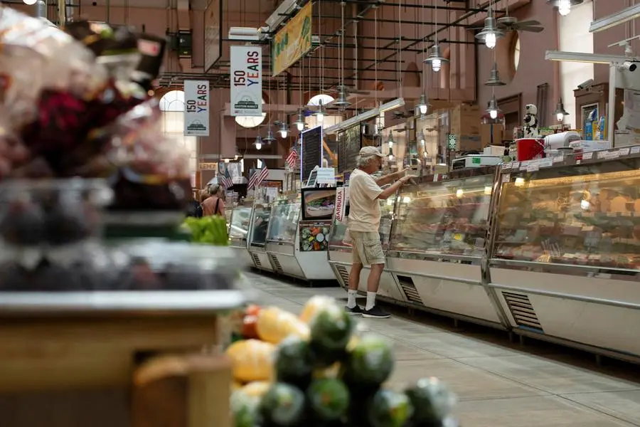FILE PHOTO: A man shops for meat at Eastern Market in Washington, U.S., August 14, 2024. REUTERS/Kaylee Greenlee Beal\\u0632 , Reuters
