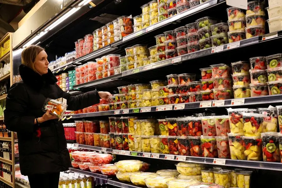 A woman shops for fruit in a store in New York City, U.S., February 12, 2025. REUTERS/Brendan McDermid , Reuters/REUTERS