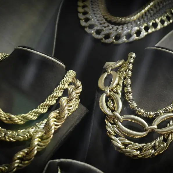 Gold holds above $5,000 on softer dollar; investors brace for US data