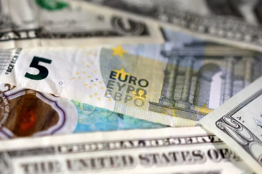 Dollar drops with US yields after data, set for fourth weekly rise vs euro
