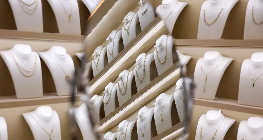 Safe-haven gold touches 2-week peak on trade tensions, rate cut hopes