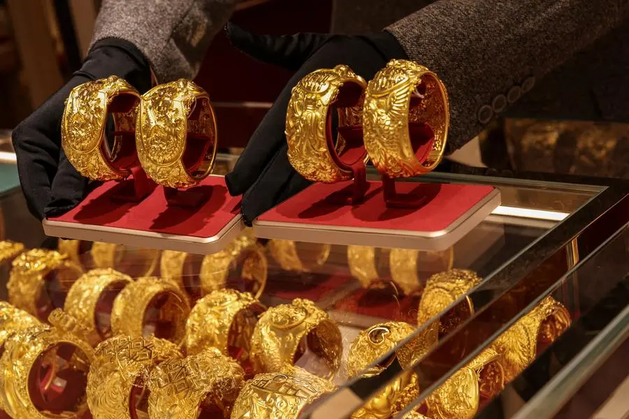 Gold rises as dollar, yields slip ahead of key US jobs data