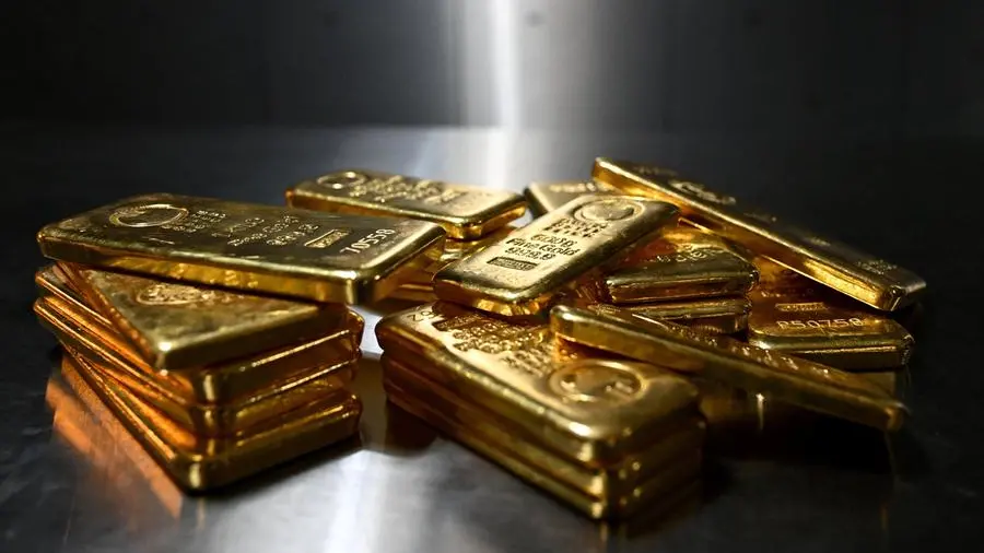 Gold slumps as bets of a more hawkish Fed chair rise; set for best month since 1980
