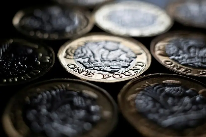 Sterling eases after UK economy unexpectedly contracts in January