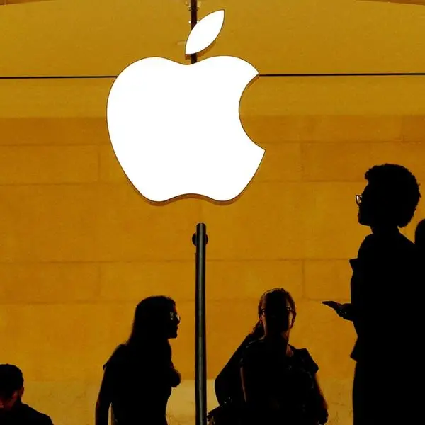 Apple girds for more trade war pain, trims buyback