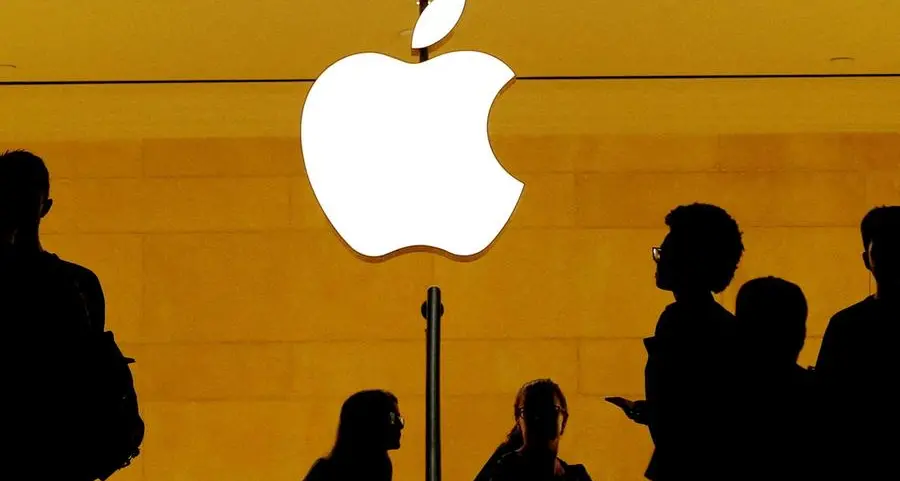 Apple girds for more trade war pain, trims buyback
