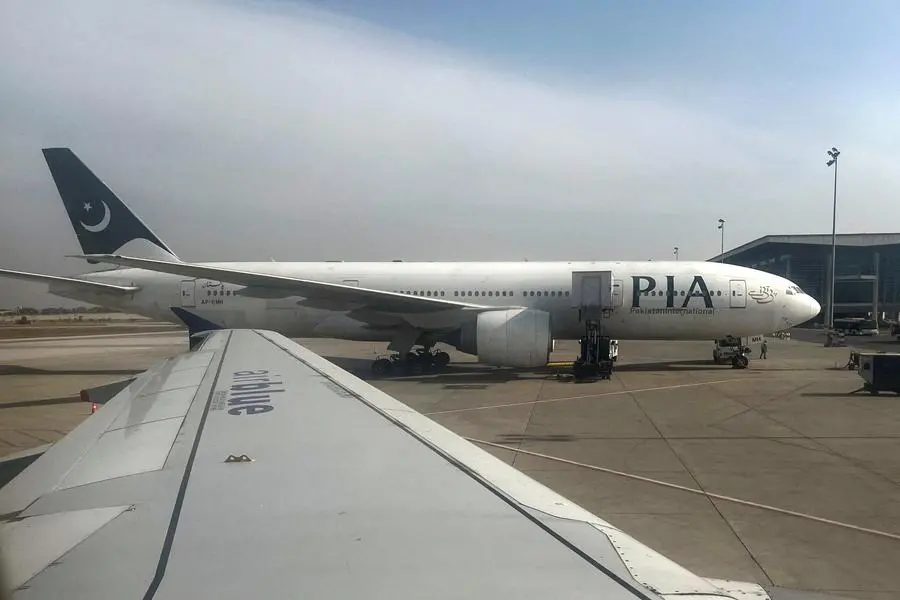FILE PHOTO: Pakistan International Airlines (PIA) passenger plane sits on tarmac, as seen through a plane window, at the Islamabad International Airport, Islamabad, Pakistan October 27, 2024. REUTERS/Akhtar Soomro. , Reuters