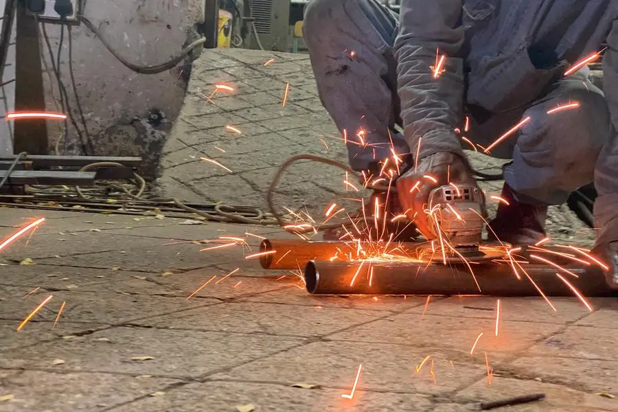 Industrial metal welding photography at night in Ghubra area in Muscat city in Oman. Image used for illustrative purpose. Getty Images , Getty Images