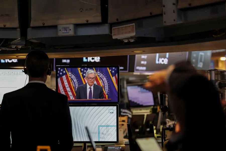 Traders work, as a screen broadcasts a press conference by U.S. Federal Reserve Chair Jerome Powell following the Fed rate announcement, on the floor of the NYSE in New York, U.S., July 30, 2025. REUTERS/Jeenah Moon. , Reuters