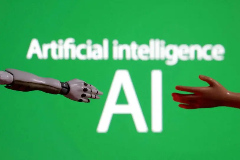 FILE PHOTO: Words reading \"Artificial intelligence AI\", miniature of robot and toy hand are pictured in this illustration taken December 14, 2023. REUTERS/Dado Ruvic/Illustration/File Photo , Reuters/REUTERS