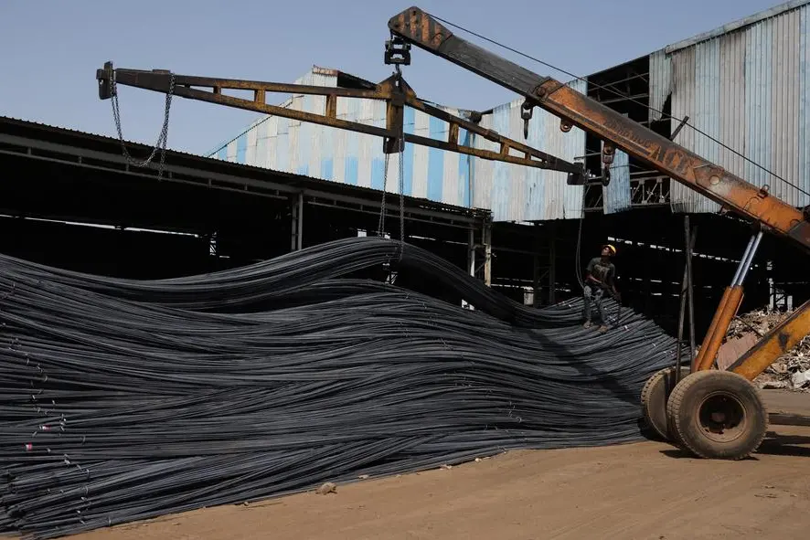 A labourer unloads TMT steel bars from a crane inside a steel bar manufacturing factory at Viramgam, in the western Indian state Gujarat, India, April 7, 2025. REUTERS/Amit Dave. , Reuters
