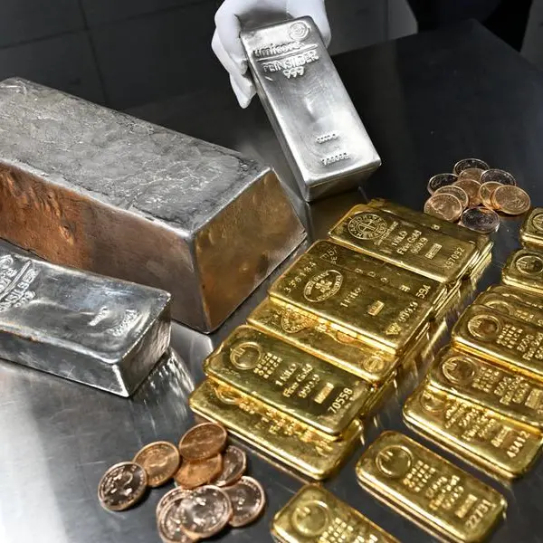Gold, silver dip as dollar rises after strong US jobs data
