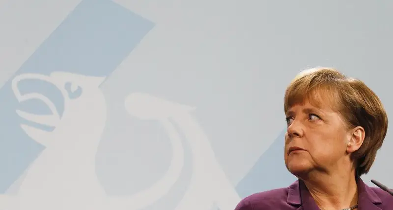 UPDATE 2-Merkel wants Germany to get refugees into workforce faster