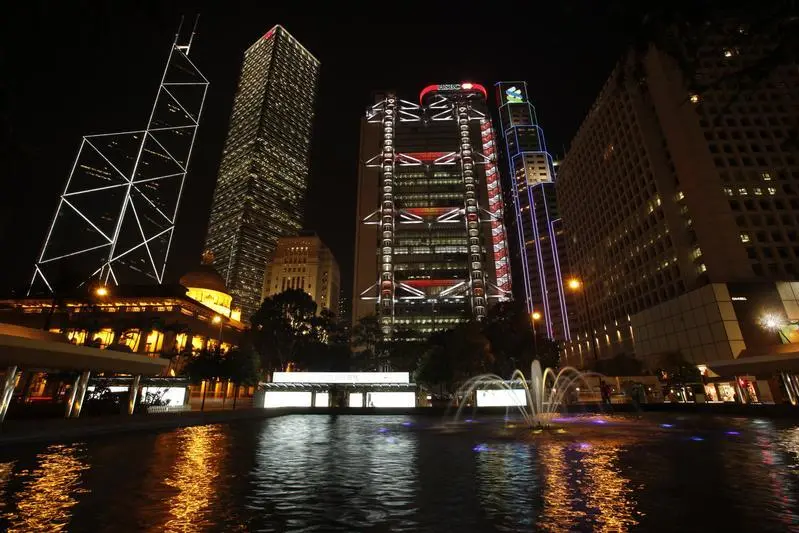 Image used for illustrative purposes. Hong Kong\\'s central financial district is pictured lighted up before Earth Hour , Reuters Images/ Bobby Yip