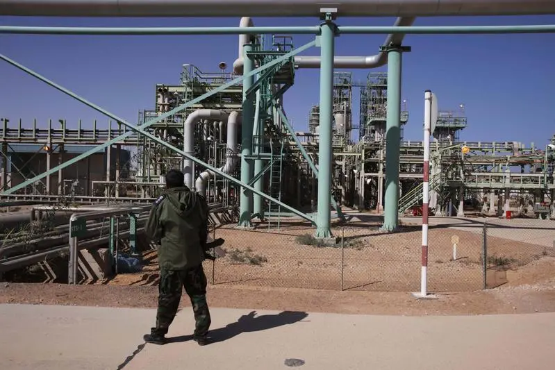 A National Transitional Council fighter patrols inside the Libyan Oil Refining Company in Ras Lanuf. Reuters, Youssef Boudlal Image used for illustrative purpose.
