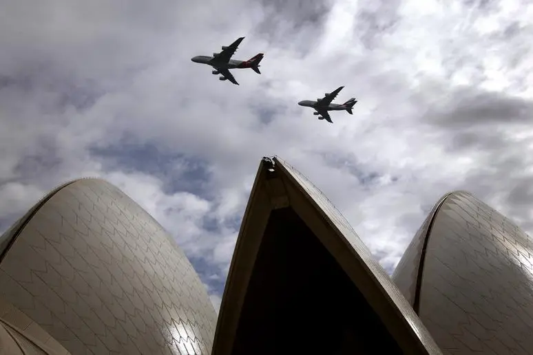 A Qantas Airways and an Emirates Airlines Airbus A380 fly above the Sydney Opera House , Reuters Images/David Gray