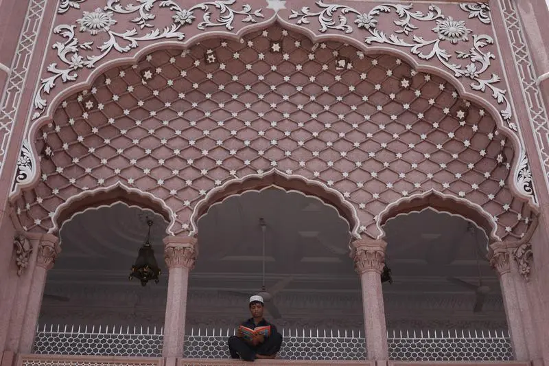 Amin, 17, recites the Koran during the Muslim holy month of Ramadan, at the Mahabat Khan mosque in Peshawar , Reuters Images/Fayaz Aziz