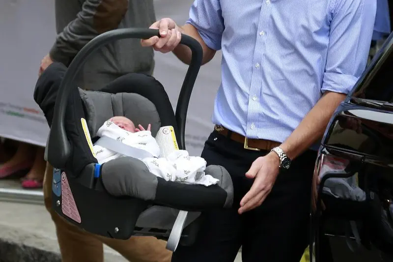Image used for illustrative purpose only. Britain\\'s Prince William carries his baby son in a car seat, as he leaves the Lindo Wing of St Mary\\'s Hospital with his wife Catherine, Duchess of Cambridge, in central London , Reuters Images/Cathal McNaughton