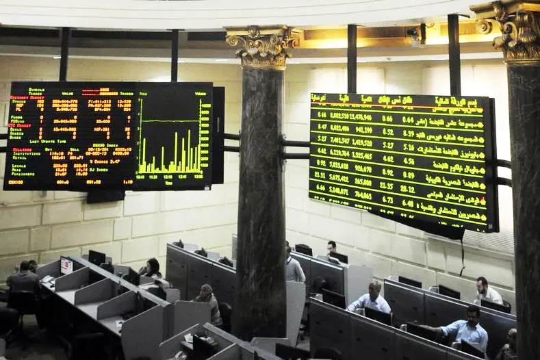 Traders work at Egypt\\'s Stock Exchange in Cairo December 8, 2013. REUTERS/Stringer-Stringer