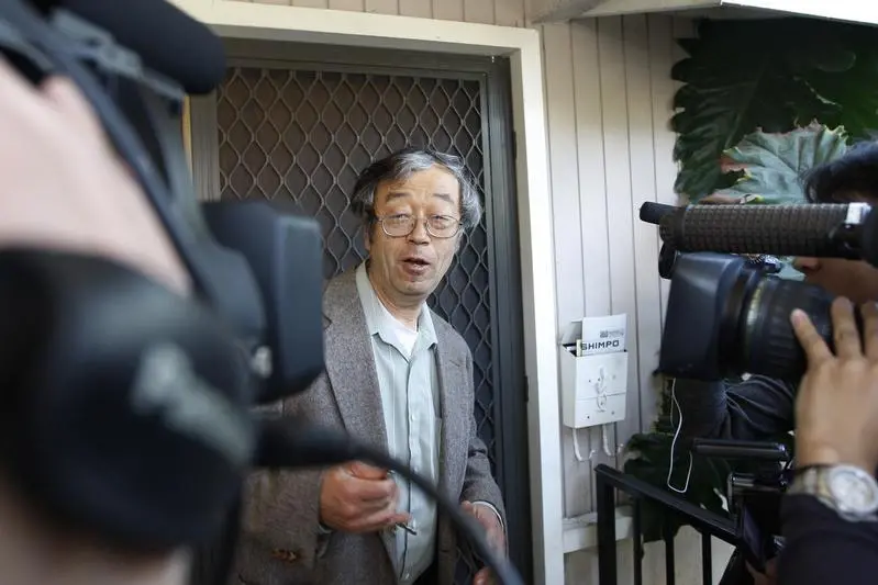 A man widely believed to be Bitcoin currency founder Satoshi Nakamoto is surrounded by reporters as he leaves his home in Temple City, California March 6, 2014. REUTERS/David McNew  , Reuters Images/David McNew 