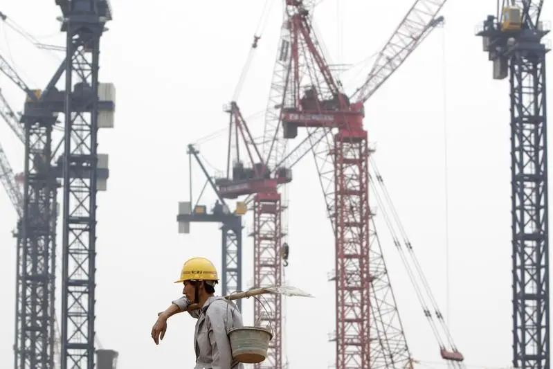 Image used for illustrative purpose.\\r\\nA migrant labour walks at a construction site near Hongqiao Airport in Shanghai June 8, 2009.REUTERS/Aly Song \\r\\n , Reuters Images/Aly Song 