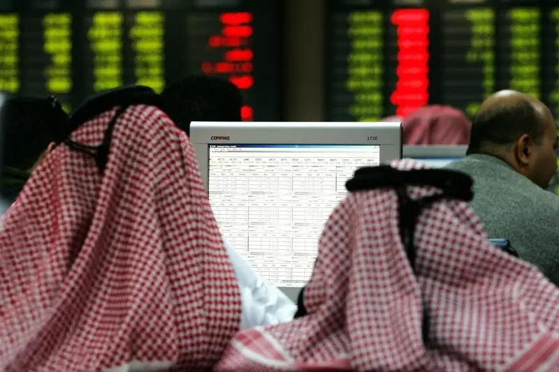 Image for illustrative purpose only. Investors watch prices on the floor of the Doha Stock Exchange in Doha, Qatar February 20, 2006. Fadi AL-Assaad Image used for illustration.