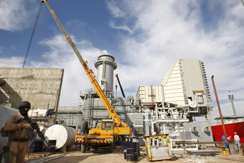 Image used for illustrative purpose. A security officer stands guard at Al-Quds power plant in northern Baghdad November 9, 2008. REUTERS/Thaier al-Sudani , Reuters