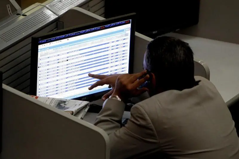 A trader works at the Egyptian stock market in Cairo .Mohamed Abd El Ghany