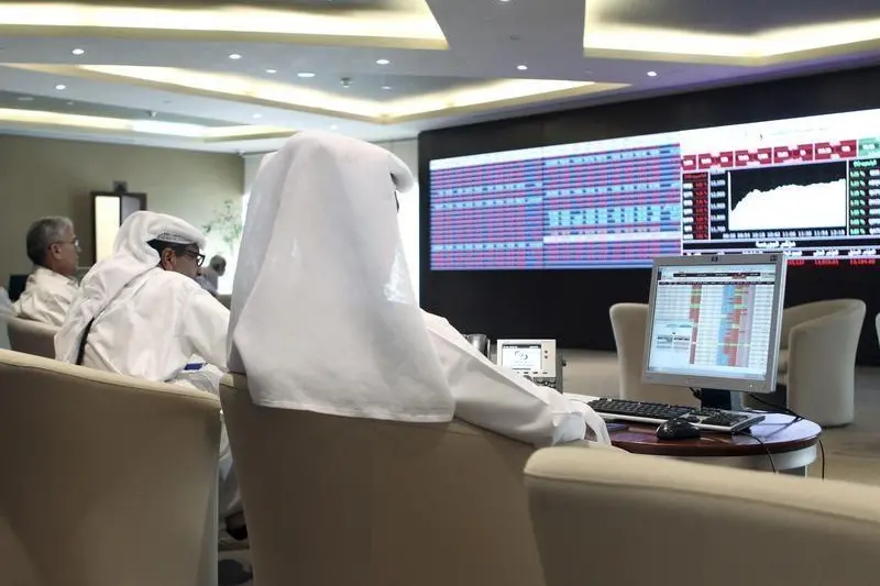 Traders watch share prices on an electronic display at the Doha Stock Exchange in Doha, Qatar June 3, 2015. . Naseem Zeitoon, Reuters