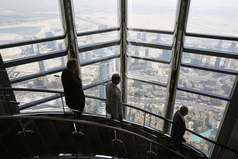 Businessmen walk down the stairs at the 123rd floor of the Burj Khalifa, the tallest building in the world, in Dubai November 19, 2014. REUTERS/Ahmed Jadallah  , Reuters Images/Ahmed Jadallah 