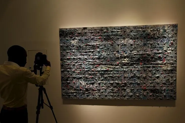 Image used for illustrative purpose.\\r\\nA TV cameraman records the paintings of Syrian artist Thaier Helal at a gallery in the Dubai International Financial center November 25, 2014.  , Reuters Images/Caren Firouz  