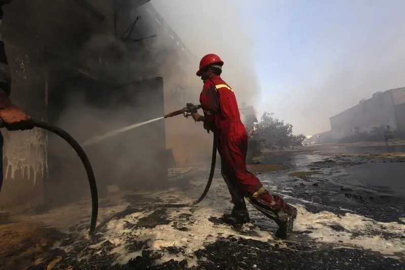 A firefighter attempts to put out a fire at a grease production plant in an industrial area in Benghazi June 17, 2012. The fire was caused during a manufacturing process that went out of control. There were no reported injuries or casualties. REUTERS/Esam Al-Fetori  , Reuters Images/Esam Al-Fetori 
