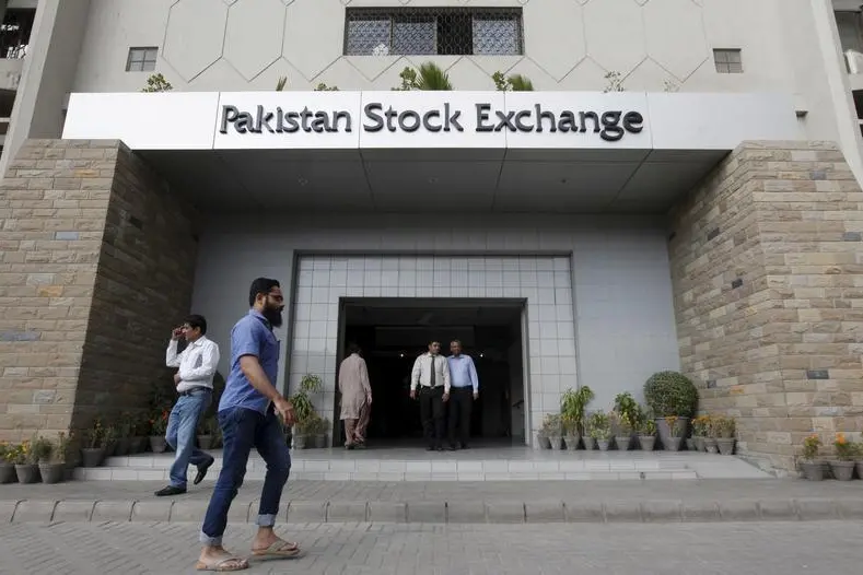 People walk outside the Pakistan Stock Exchange building in Karachi, Pakistan, January 11, 2016. The Karachi Stock Exchange on Monday became the Pakistan Stock Exchange Ltd after merging with two other bourses - Islamabad and Lahore stock exchanges, according to a regulatory statement.Reuters Images/Akhtar Soomro