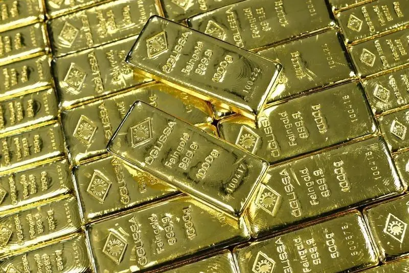PRECIOUS-Gold inches higher on weaker dollar; stock recovery caps gains