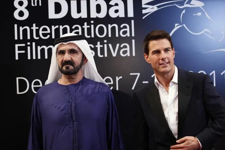 Sheikh Mohammed bin Rashid Al Maktoum (L), vice-president of the UAE and ruler of Dubai, poses at the red carpet with U.S. actor Tom Cruise as they arrive during the opening ceremony of the 8th Dubai International Film Festival for the premiere of Cruise\\'s new movie \"Mission Impossible: Ghost Protocol\" December 7, 2011.  REUTERS/Jumana El Heloueh  , Reuters Images/Jumana El Heloueh 