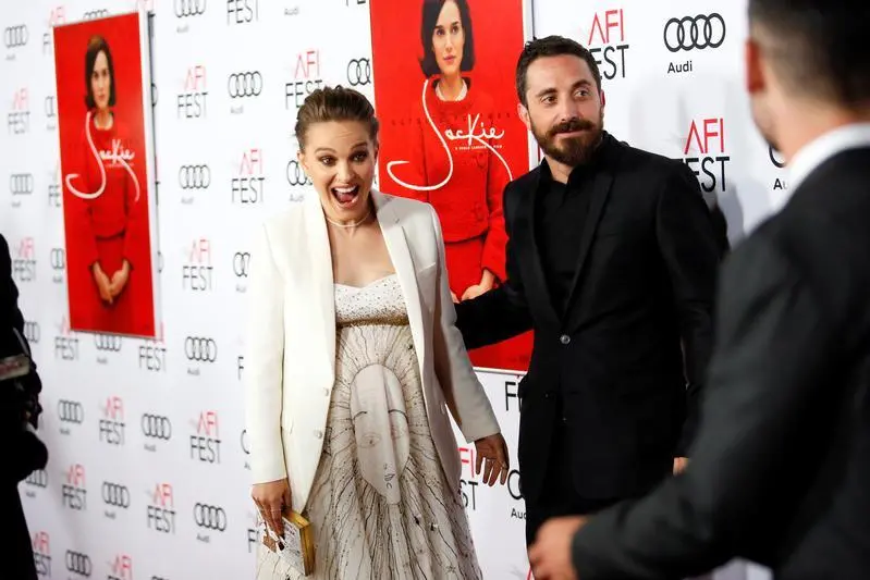 Actor Natalie Portman (L), who is pregnant and portrays Jacqueline Kennedy, reacts next to director Pablo Larrain (R) as she sees other co-stars at a screening of \"JACKIE\" as a part of AFI Fest in Los Angeles, California, U.S. November 14, 2016. REUTERS/Danny Moloshok , Reuters Images/Danny Moloshok 