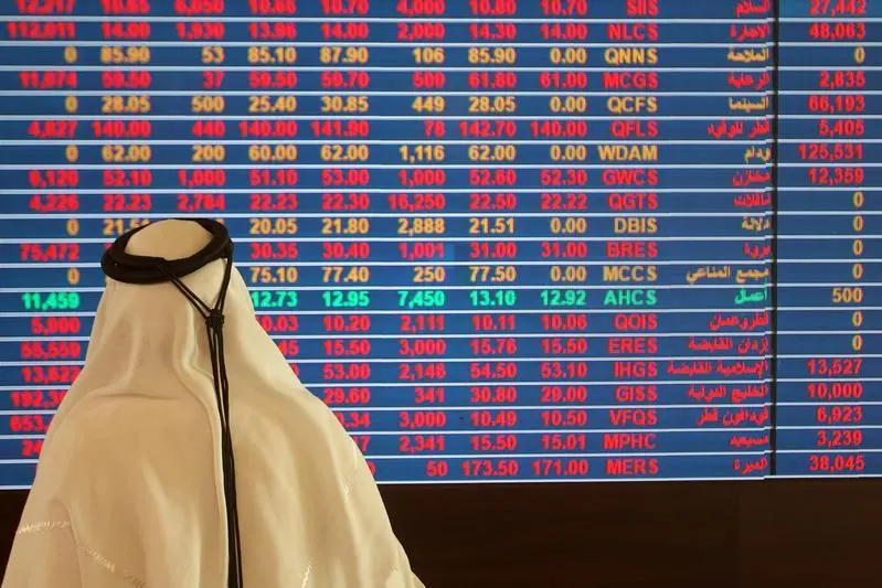 A trader monitors a screen displaying stock information at Qatar Stock Exchange in Doha, Qatar November 9, 2016. , Naseem Zeitoon