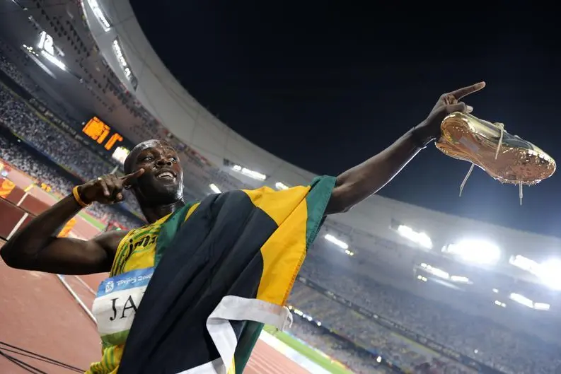 Usain Bolt of Jamaica celebrates after his team won the men\\'s 4x100m relay athletics final in the National Stadium during the Beijing 2008 Olympic Games August 22, 2008.REUTERS/Kai Pfaffenbach , Kai Pfaffenbach